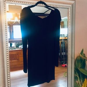 Long sleeve black mini dress.